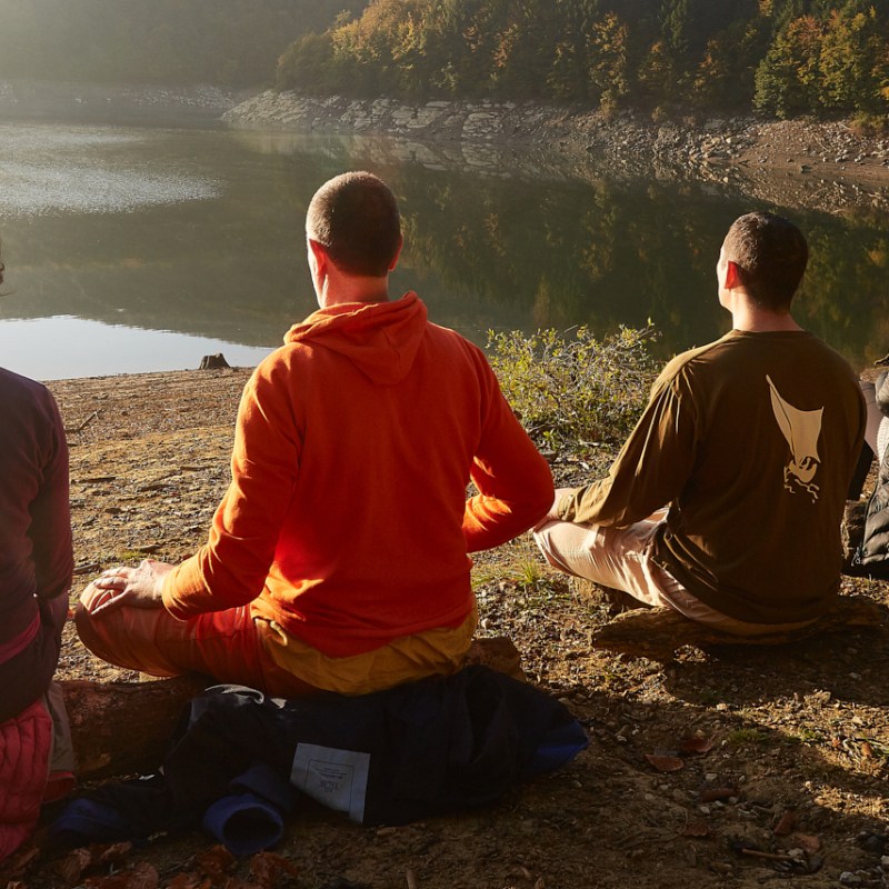 a man and a woman sitting at a beach