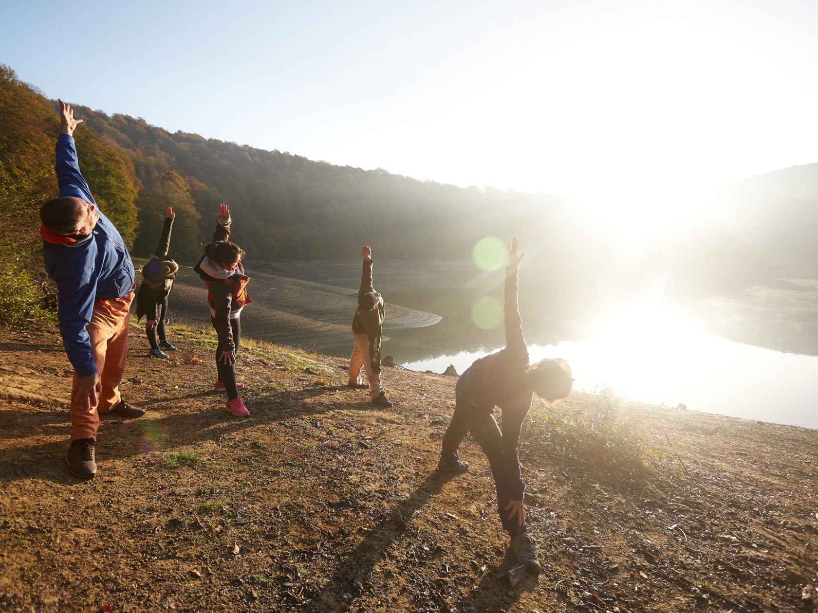 a couple of people that are standing in the sand