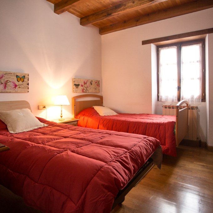 a bedroom with a large bed sitting in a room