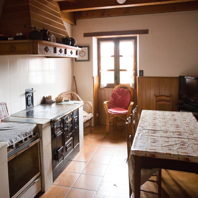 a kitchen with a table in a room