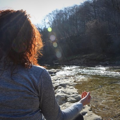 a person standing in front of a body of water
