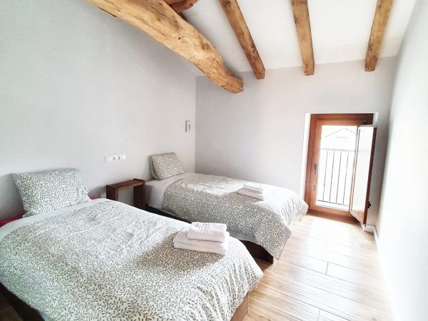 a bed with a wooden floor