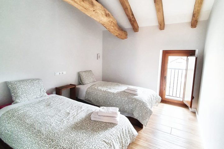 a bed with a wooden floor