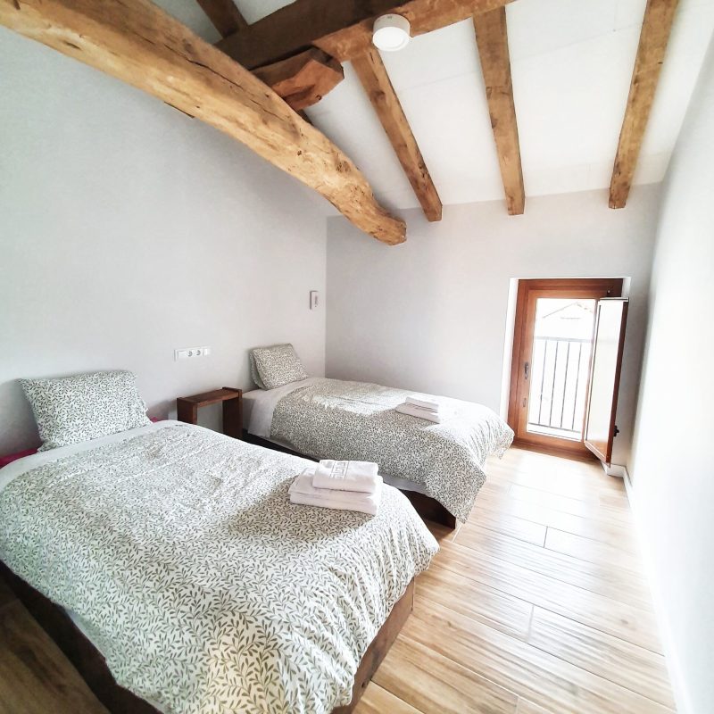 a bed with a wooden floor