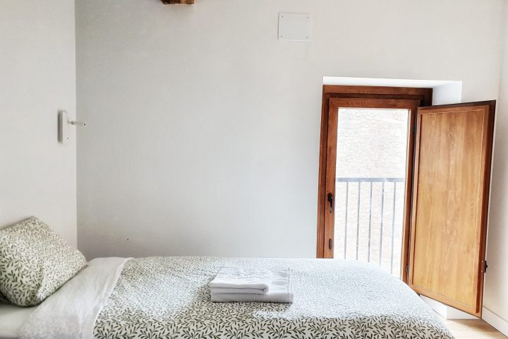 a bedroom with a wooden door