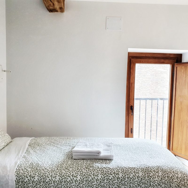 a bedroom with a wooden door