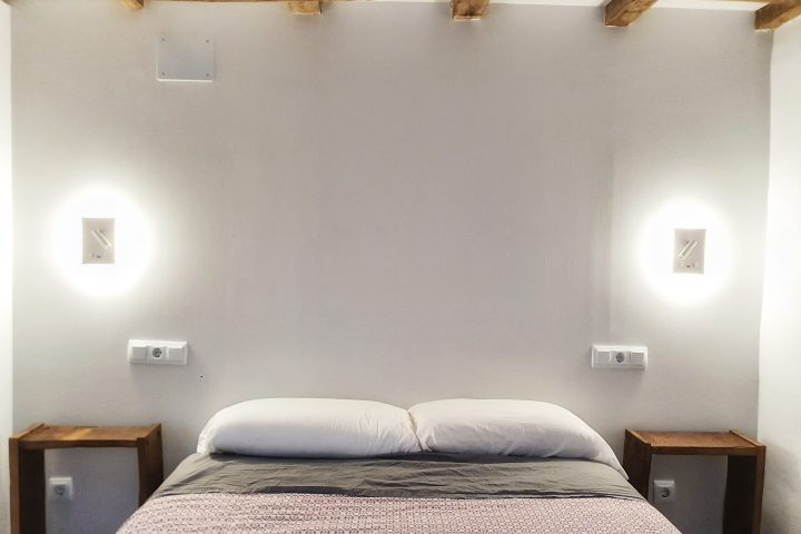 a bedroom with a large bed in a hotel room