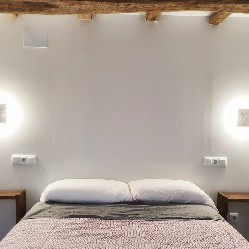 a bedroom with a large bed in a hotel room