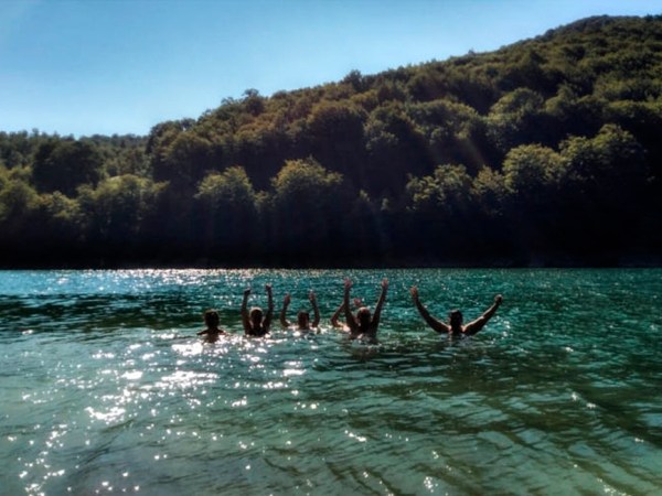 a group of people swimming in a body of water