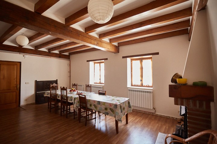 a living room filled with furniture and a wood floor