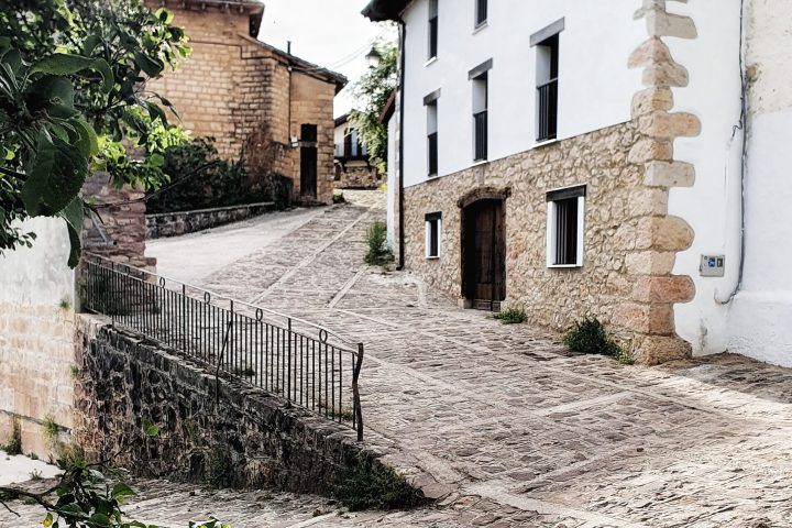 a path leading to a brick building