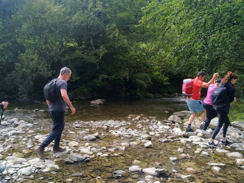 a group of people standing on a rock