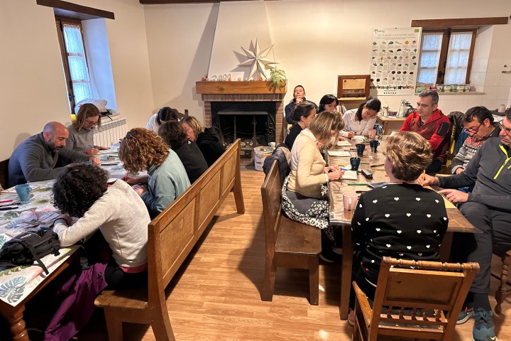 a group of people sitting at a table