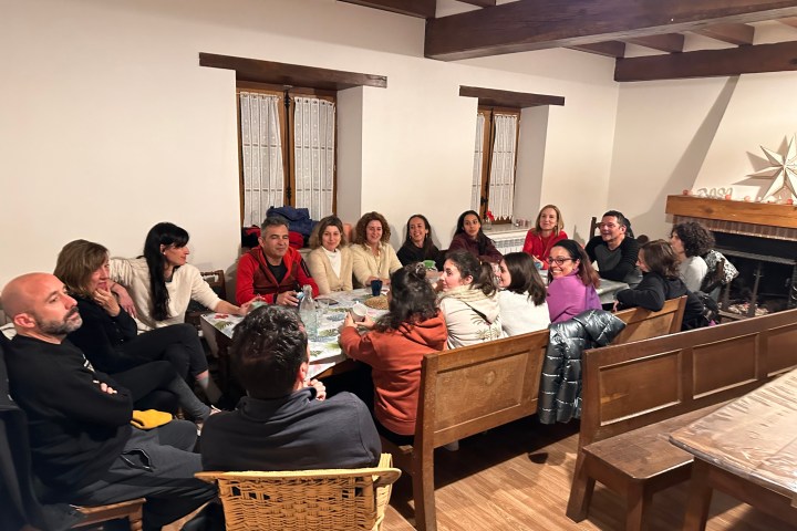 a group of people sitting at a table