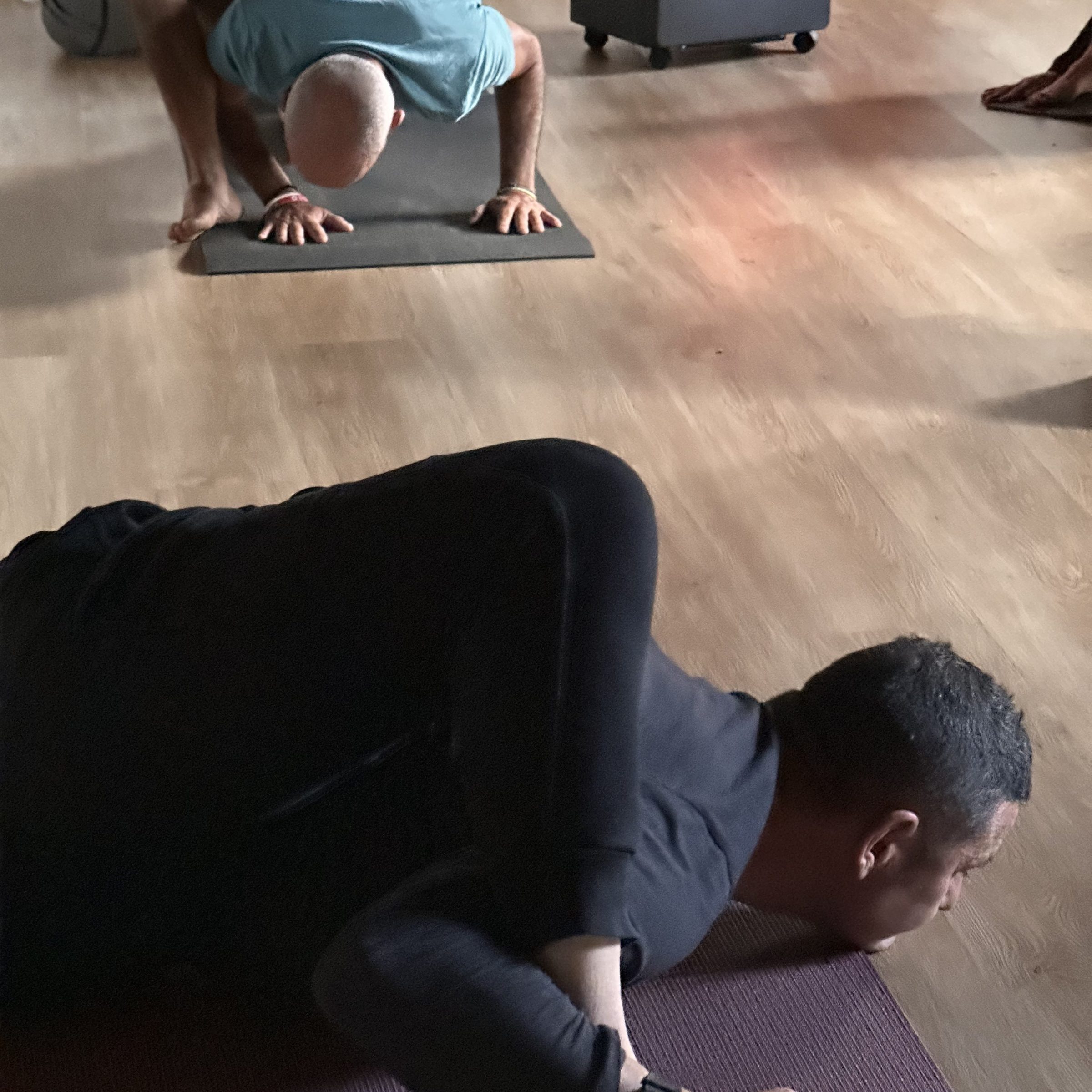 a man sleeping in front of a laptop