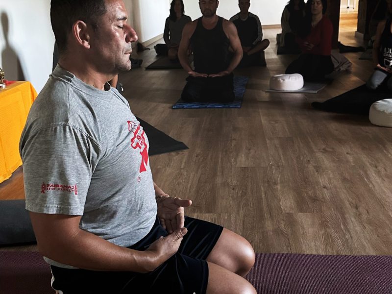a group of people sitting around a living room