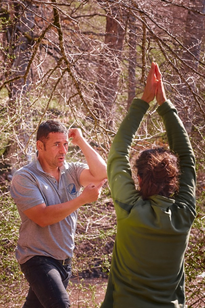 a man and a woman playing with a frisbee