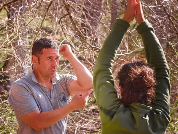 a man and a woman playing with a frisbee